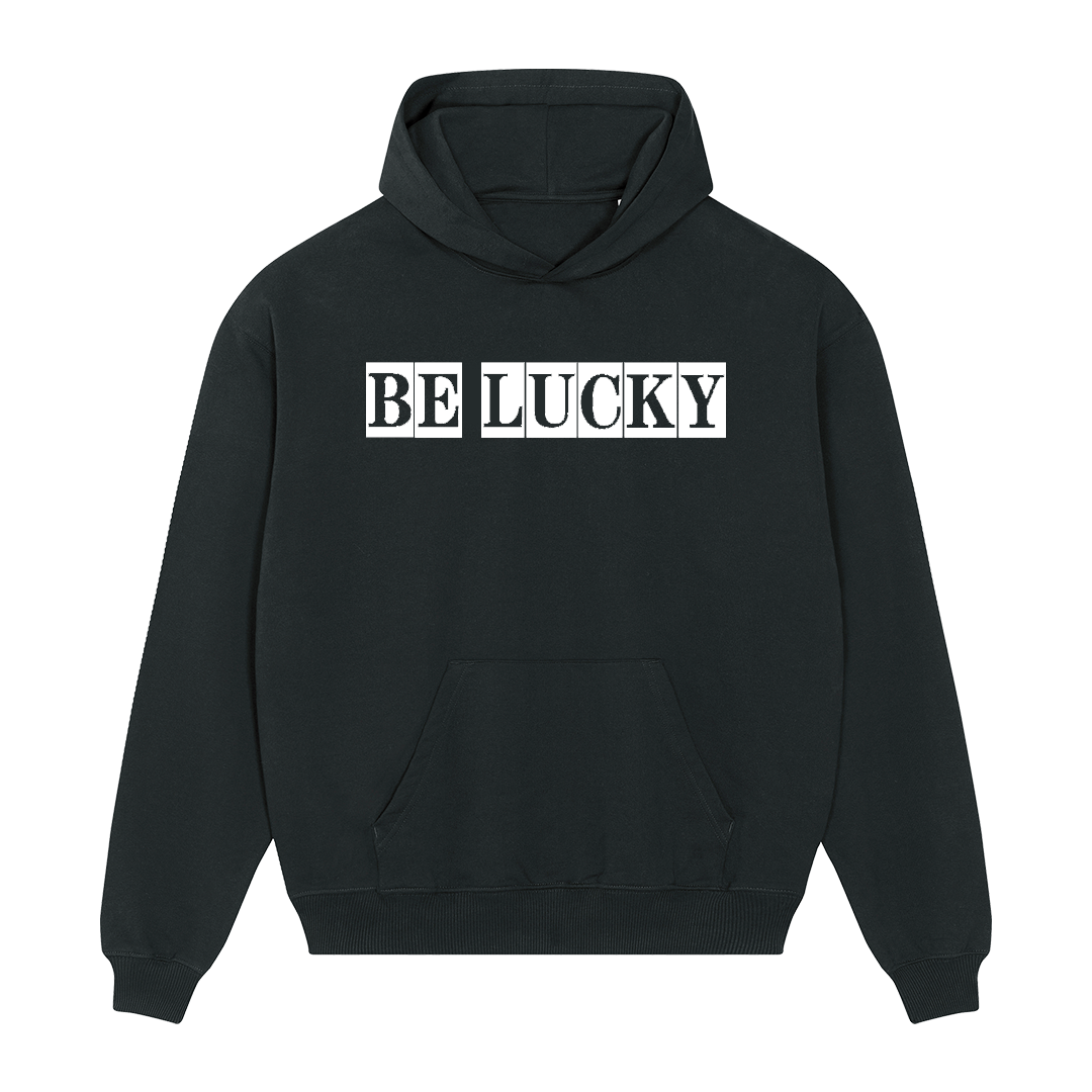 Front view of a black unisex hoodie with 'Be Lucky' text printed in a typewriter font across the chest