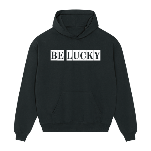 Front view of a black unisex hoodie with 'Be Lucky' text printed in a typewriter font across the chest